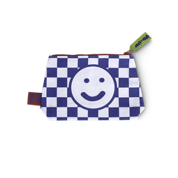 The Lush x Lazy wash bag, a white and navy blue checkered pattern, a happy face design with a green zipper tag and red accents.