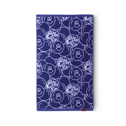 The Lush x Lazy hand towel, navy blue and white Bubbly Buddy repeated design with the Lush x Lazy logo.