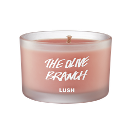 The Olive Branch scented candle, candle is shown from the side, where the pink wax can be seen through frosted glass.