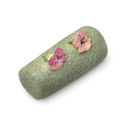 Aloe Bamboo. A light green, cylindrical sugar cleanser roll with a visibly granular texture and topped with fresh pink flowers.