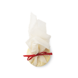 Ceridwen's Cauldron Bath Melt. Wrapped in white muslin cloth and tied with a red ribbon is a cream coloured, round bath melt.