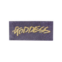 A purple, rectangular washcard, consisting of apple pulp, with 'Goddess' written across it in gold Lush writing.