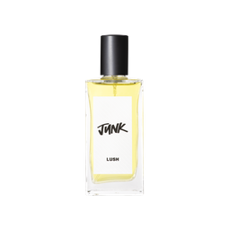 A glass perfume bottle filled with pale yellow liquid. A white label reads 'Junk'.