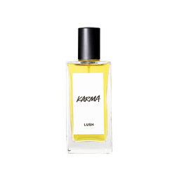 A glass perfume bottle filled with canary yellow liquid. A white label reads 'Karma'.