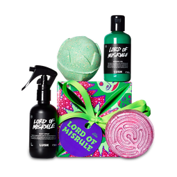 Lord of Misrule gift, green jester-like faces scatter over a pink dotted background on a square gift box.