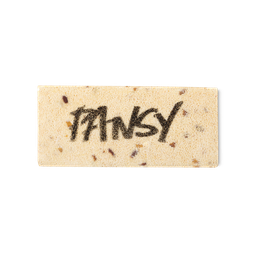 A cream coloured, rectangular washcard, consisting of apple pulp, with 'Pansy' written across it in black Lush writing.