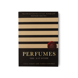 The book Perfumes, The A-Z Guide presented with black and cream embossed stipes.
