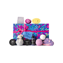 Relax More. A large, pink and blue floral printed, rectangular box, tied with a hot pink ribbon and a blue gift tag.