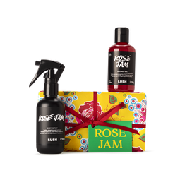 Rose Jam. A rectangular box, wrapped in yellow, red rose printed Khadi paper, tied with a deep red ribbon and a green gift tag.