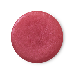 An arial view of fuchsia pink, balm-like Rose Jam solid perfume.