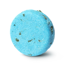 Seanik. A bright blue, circular solid shampoo bar, with tiny pieces of green seaweed pressed within.