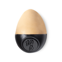 Slap Stick 10C. A light-cool, warm beige coloured, egg-shaped solid foundation, with a black wax base.