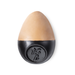 Slap Stick 13C. A medium light-cool, warm, rosy-beige coloured, egg-shaped solid foundation, with a black wax base.