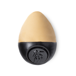 Slap Stick 15W. A medium light-warm, light-tan coloured, egg-shaped solid foundation, with a black wax base.