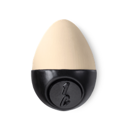 Slap Stick 1C. A light-cool, cream coloured, egg-shaped solid foundation, with a black wax base.