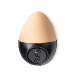 Slap Stick 7C. A light-cool, warm rosy-beige coloured, egg-shaped solid foundation, with a black wax base.