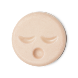 Sleepy Face. A circular, pale peachy pink naked cleansing balm, engraved with little yawning face.