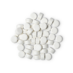 A pile of small, circular, white Sparkle toothpaste tabs shot from above. 