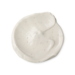 A swatch of light cream coloured Sympathy for the Skin body lotion, with tiny dark brown flecks, which are vanilla pod seeds.
