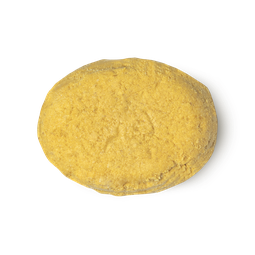 The Golden Cap. A golden yellow, oval shaped solid conditioner bar.