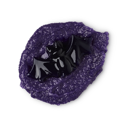 Toil and Trouble scrub, a black shower jelly bat sits on top of purple body scrub.