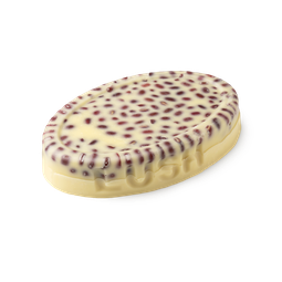 Wiccy Magic Muscles. A buttery yellow, oval shaped, solid massage oil bar, with LUSH imprinted on its edge, 