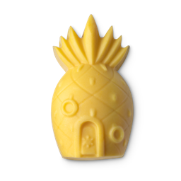 Home Sweet Pineapple Body Balm. A golden, yellow body balm shaped like the iconic pineapple house.