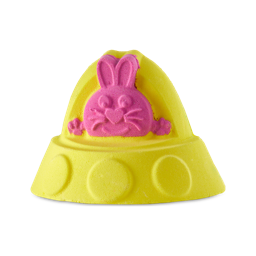 Alien Bunny Spaceship. A bright yellow bath bomb shaped like the typical domed spaceship with a pink bunny in the middle.