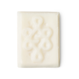 Aromaco. An off-white, rectangular block of solid deodorant, complete with an intricate surface design.