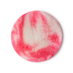 A circular swatch of the Barbie Dream sugar scrub which is pretty, gritty swirls of pink and white. 