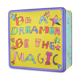 A deep, square metal tin with lilac-purple edges. The lid has a big yellow base with the words "Be A Dreamer, Be The Magic" illustrated in big block, bubble letters surrounded by stars. 
