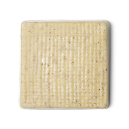 Buffy. A cream coloured, rounded square shaped, solid body butter, flecked with ground rice, almonds and aduki beans.