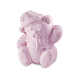Butterbear. A pastel pink bath bomb with flecks of cocoa butter is shaped like a waving bear in a scarf and hat. 
