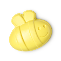 Buzzy Mum. A pale yellow soap in the shape of a bumblebee, with a cheerful smiling face. 