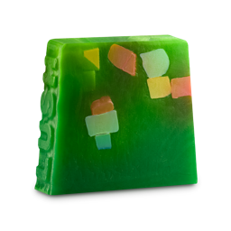 Christmas Lights. An off-square, thick soap slice with "LUSH" embedded on one edge. It is a bright green colour with pops of blue, yellow and red soap chunks throughout.