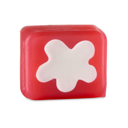 Christmas Pudding. A thick, rounded-cube-shaped soap. It is a deep red colour with a pale, curved "splat" shape on the front. 