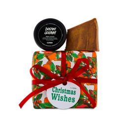 Christmas Wishes. A festively wrapped gift box with Golden Linseed soap and Dream Cream body lotion on top. 