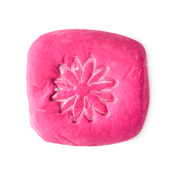 Creamy Candy bubble bar. A vibrant, hot pink rounded block, embossed with a flower on top.