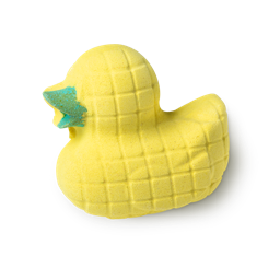 Disco Duck bath bomb, a yellow 3D duck shaped bath bomb, with green beak and straight lines over to look like a disco ball. 