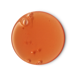 Flower Gel. A circular swatch of gentle, almost-apricot-coloured shower gel with a few small bubbles on the edge. 
