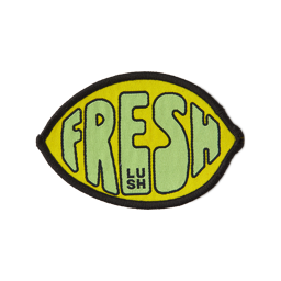 Fresh Values. A yellow, lemon-shaped fabric patch with a black border and the word "FRESH" in green bubble letters. 