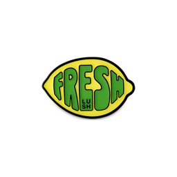 Fresh Values. A yellow, lemon-shaped metal badge with a black border and the word "FRESH" in green bubble letters. 