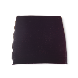 Goddess. A deep purple, smooth, trapezium shaped soap, with a touch of shimmer, and bumps along its left side.