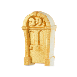 Iconic Door. A fully golden-lustre covered bath bomb shaped like the iconic arched doorway of LUSH's original shop, complete with an embossed "29½" in the semicircle above the door. 