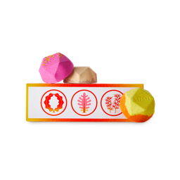 Ippuku warming gift. A warm orange and yellow patterned oblong box with three geometric bath bombs.