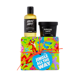 Jingle All The Way. A Vibrantly wrapped gift box with Happy Hippy shower gel and Bouncing Santa shower jelly pot on top. 