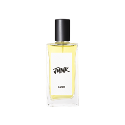 A glass perfume bottle filled with pale yellow liquid. A white label reads 'Junk'.