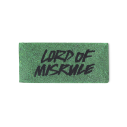 A dark green, rectangular washcard, consisting of apple pulp, with 'Lord of Misrule' written across it in black Lush writing.