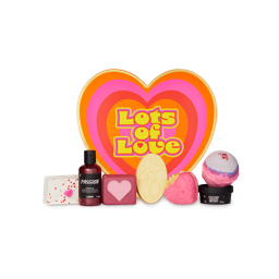 Lots of Love gift. A heart-shaped gift box surrounded by 7 themed LUSH goodies including bath bombs, shower gels and soap.