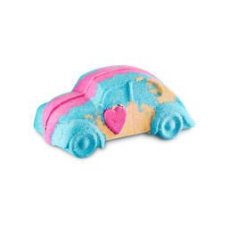 Love Bug. A bath bomb shaped like a classic Beetle car coloured in blue, pink and yellow. A small pink heart sits on the door.